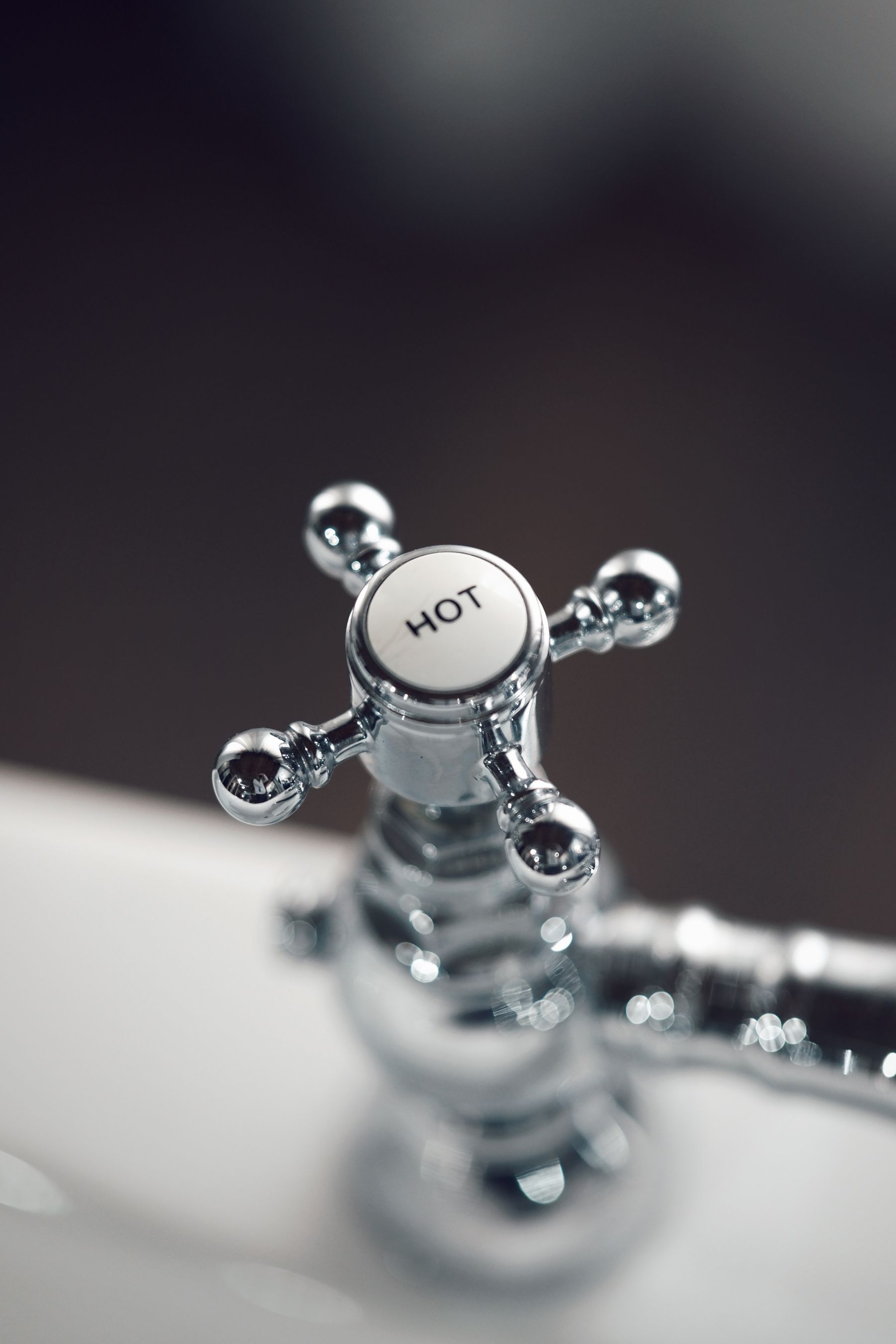 Chrome hot water tap close-up